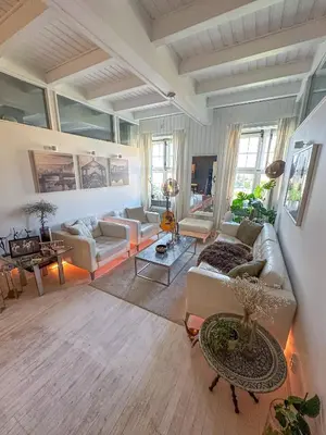 a living room with a couch and a table at Modern and spacious home in Trondheim