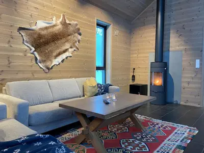 a living room with a couch and a table at The Lookout At Beitostølen in Beitostøl
