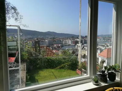 a window with a view of a city at 2-roms leilighet med spektakulær utsikt og privat hage in Bergen