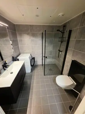 a bathroom with a shower and a toilet and a sink at Nice apartment in the center of Trysil 402 in Trysil