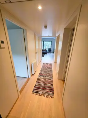 a hallway with a rug on the floor of a house at Nice apartment in the center of Trysil 402 in Trysil