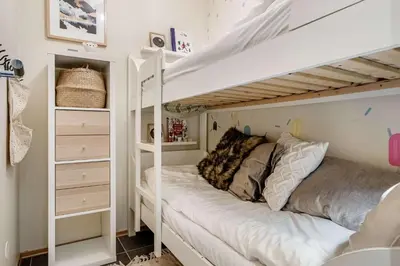 a bunk bed in a room with a bunk bed in a bedroom at Fageråsen 963 by Vacation Trysil in Trysil