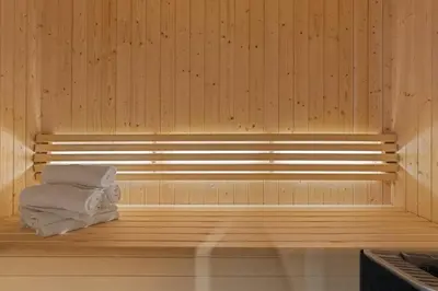 a sauna with a stack of towels sitting in it at Mountain Chalet 958 by Vacation Trysil in Trysil