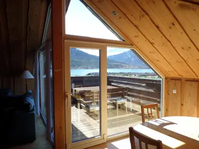 a view of a room with a large glass window at Solstrand Fjord Holiday in Eidsvåg