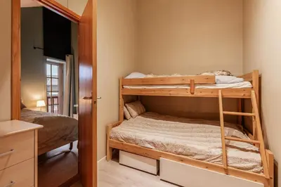 a bedroom with two bunk beds in a room at Alpine Apartment with Parking and Balcony in Ustaoset