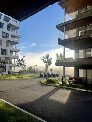 an empty street in front of a building at Stylish home near airport in Bergen