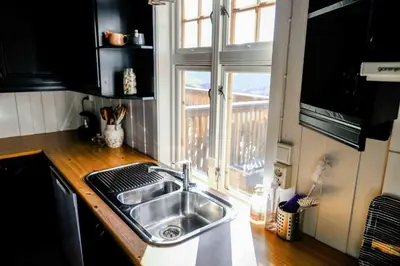 a kitchen with a sink and a window at Leave It All in Venabygd