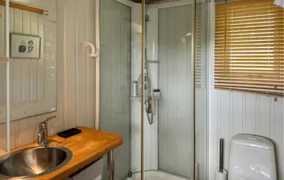 a bathroom with a sink and a shower at Cozy Home In Førde I Hordaland in Erve