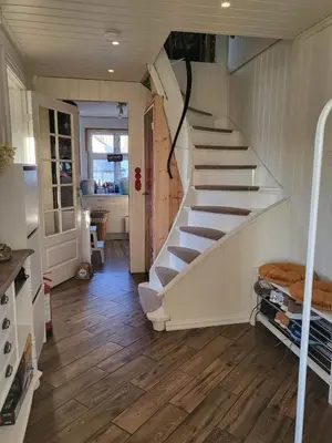 a room with a staircase in a house at Cozy house in historical area in Bergen