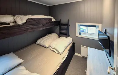 two bunk beds in a room with a window at Awesome Apartment In Trysil With Sauna in Trysil