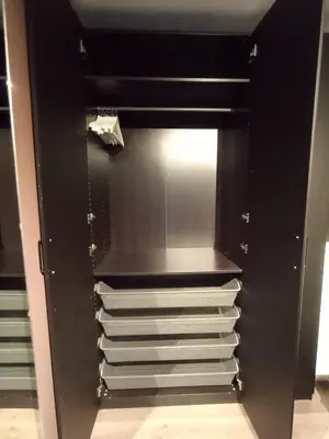 a black refrigerator with its door open with empty shelves at Cozy Studio in Hallset, Trondheim in Trondheim