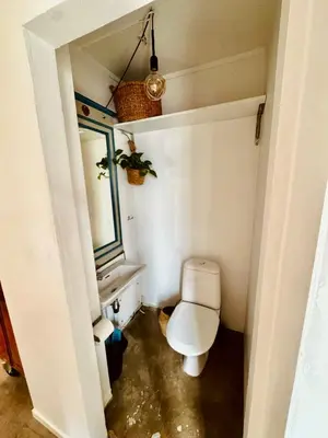 a bathroom with a toilet and a sink at Charming in the center of Hamar in Hamar