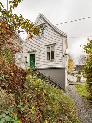 a white house with a green door and stairs at Bergen Villa - Charming 3 Bedroom with Views! in Bergen