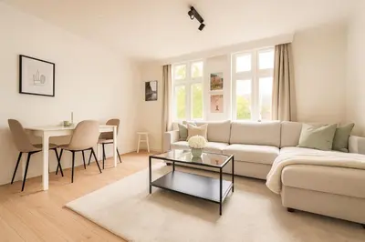 a living room with a couch and a table at Twin Flat 2nd Floor Bergen Centre - Norwegians minimum age 25 in Bergen