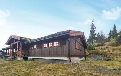 a wooden house sitting on top of a hill at 4 Bedroom Gorgeous Home In Rjukan in Rjukan