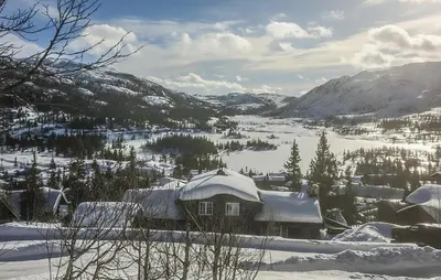 a house covered in snow on a snowy mountain at 4 Bedroom Gorgeous Home In Rjukan in Rjukan
