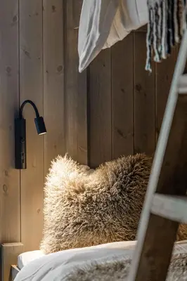 a brown furry pillow sitting on top of a bed at Trysilfjell hytteområde 2115 by Vacation Trysil in Trysil