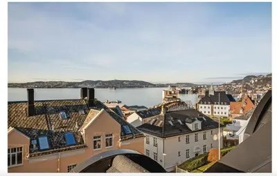 an aerial view of a city with a body of water at Bergenhus apartment in historical Sandviken in Bergen