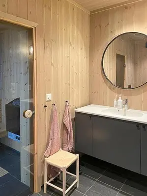 a bathroom with a sink and a mirror at Mountain Cabinin Valdres in Aurdal