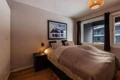 a bedroom with a bed and a window at Geilo Town Centre - Apartment with a Superb Location and walking Distance to Everything in Geilo