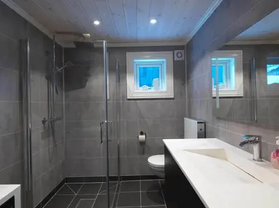 a bathroom with a shower and a toilet and a sink at Stranda Fjellgrend 3 bedrooms - 12A in Stranda
