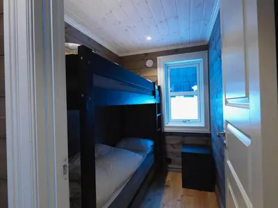 a small room with a bunk bed and a window at Stranda Fjellgrend 3 bedrooms - 12A in Stranda
