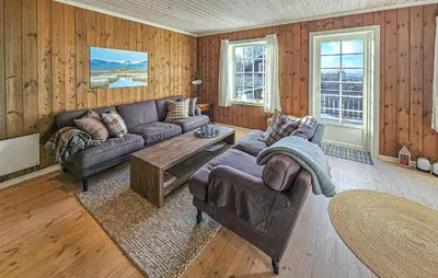 a living room with a couch and a table at Nice Home In Rauland With Wifi in Rauland