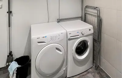 a washing machine and a washer in a laundry room at Awesome Apartment In Eidfjord in Eidfjord