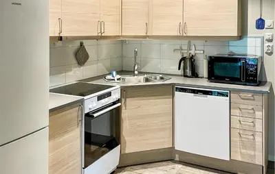 a small kitchen with a sink and a microwave at Awesome Apartment In Eidfjord in Eidfjord