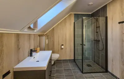 a bathroom with a shower and a sink and a toilet at Beautiful Home In Bøvågen With Sauna in Bøvågen