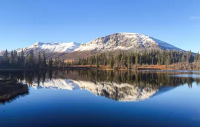 a mountain reflecting in a lake with its reflection at Awesome Home In Hemsedal With Sauna in Hemsedal