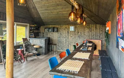 a dining room with a long table and chairs at Stunning Home In Røros With Sauna in Røros