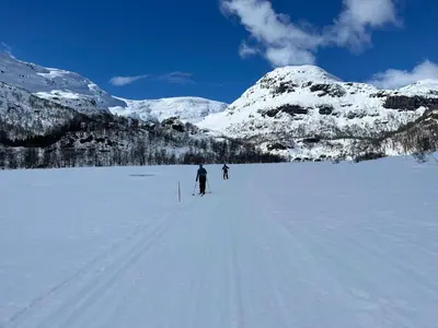 two people cross country skiing on a snow covered mountain at Modern Cabin Near Maldalsvatnet And Reinsnuten in Sauda