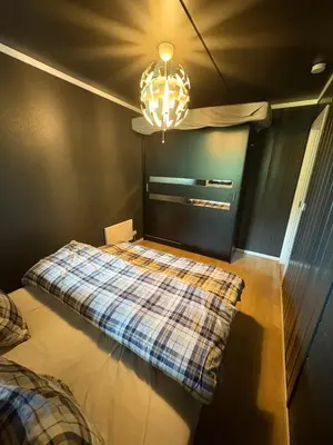 a bedroom with a bed with a checkered blanket at Norefri - Norefjell in Noresund