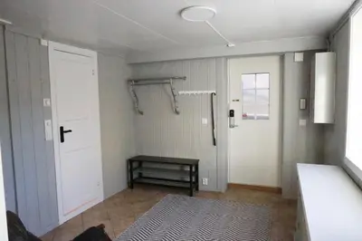 a small room with a shower and a door at Central apartment in Lillehammer in Lillehammer