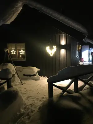a room with snow on the ground and lights at Utibakken - cabin ski inn-out Norefjell in Surteberg
