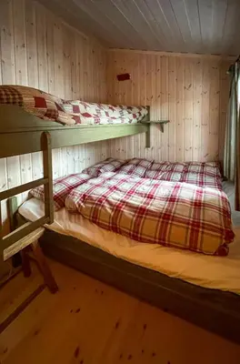 a room with two bunk beds in a cabin at Family Cabin From 1968 At Norefjell in Noresund