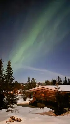 a log cabin with snow on the ground at Cabin With Ski-Inout And Hot Tub In Fageråsen in Trysil