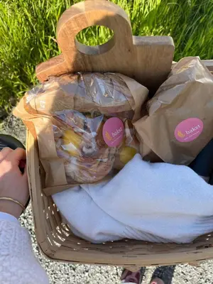 a basket full of bags of food sitting on the ground at Nygård Panorama in Stryn