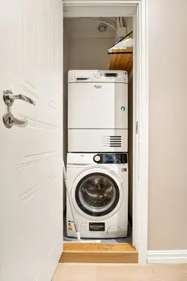 a washer and dryer sitting inside of a closet at Modern Apartment in Bergen