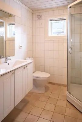 a bathroom with a toilet and a sink and a shower at Stranda Fjellgrend 2 bedrooms - 76B in Stranda