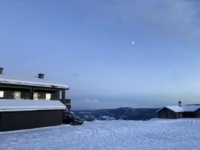 a snow covered yard with a house and some buildings at Apartment in Gol Skisenter in Gol