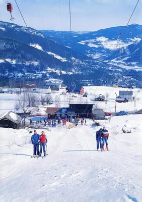 a group of people on a ski lift in the snow at Apartment in Gol Skisenter in Gol