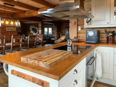 a kitchen with a wooden counter top in a cabin at Family Cabin With Panoramic Views In Aurdalsåsen in Aurdal