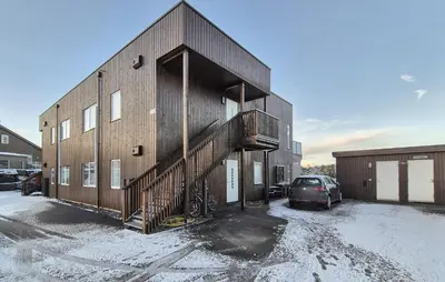 a building with a staircase on the side of it at Awesome Apartment In Finnås With House Sea View in Vinnes