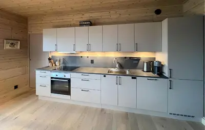 a kitchen with white cabinets and a sink at Amazing Apartment In Øyer With Wifi in Øyer