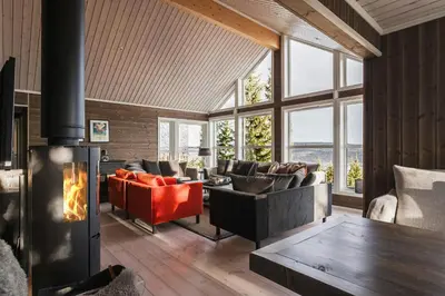 a living room with couches and a fireplace at Mountain Cabin With Ski Inout In Trysil in Trysil
