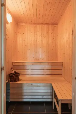 a sauna with a bench and a basket in it at Mountain Cabin With Ski Inout In Trysil in Trysil