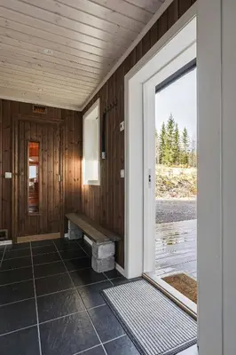 an open door to a porch with a bench at Mountain Cabin With Ski Inout In Trysil in Trysil