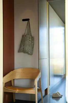 a wooden table with a bag hanging on a wall at Modern Cabin By The Cross-Country Trails in Svene